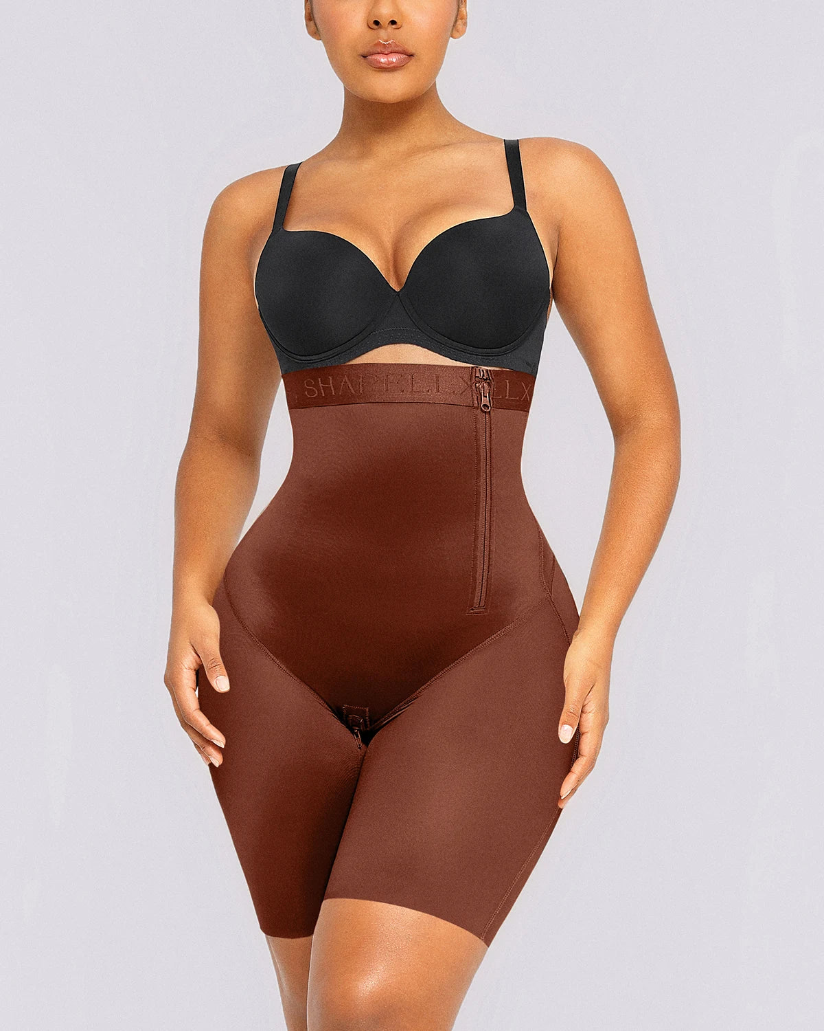 Model wearing high-waist shaping shorts for a smooth and defined waistline