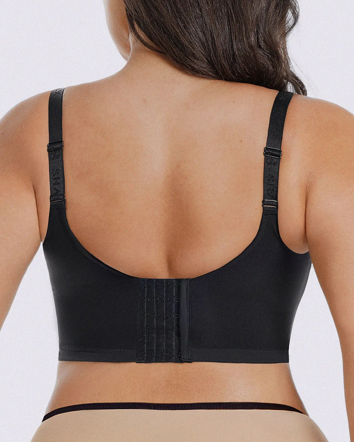 Back-smoothing bra design minimizing visible lines under clothing