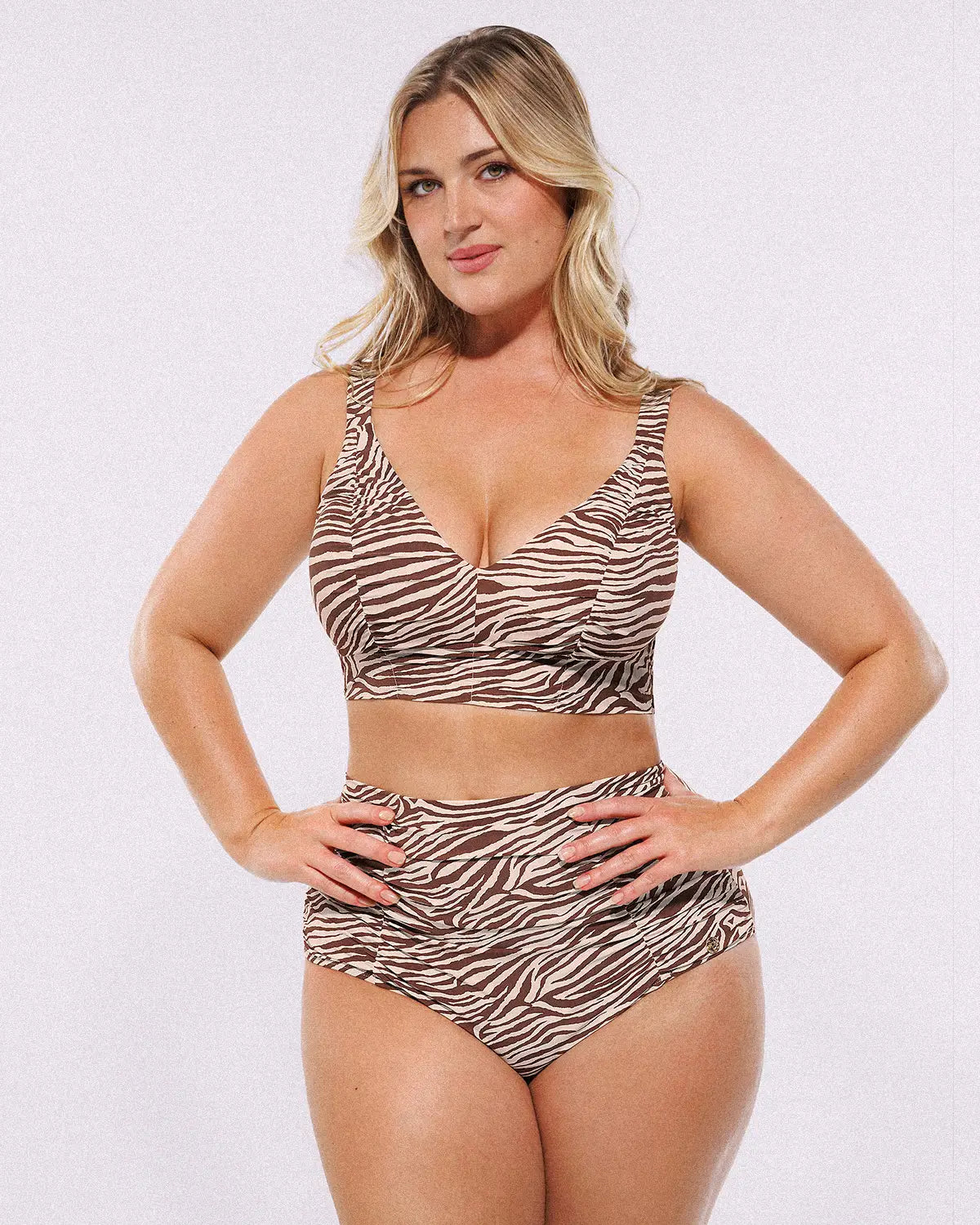Model wearing Smart Sculpt Ruched V-Neck Bikini Top and High-Waisted Bottom Set, showing tummy-smoothing fit