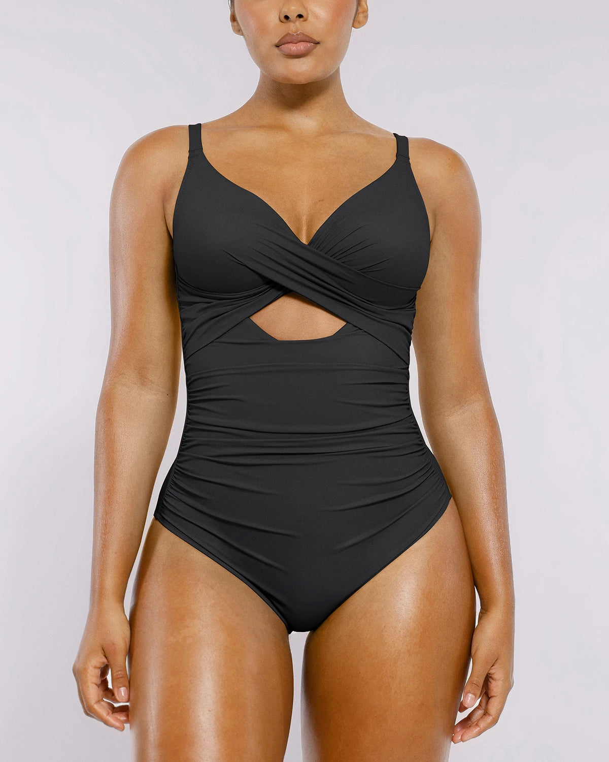 Model wearing ribbed cutout-front swimsuit with sculpting fit
