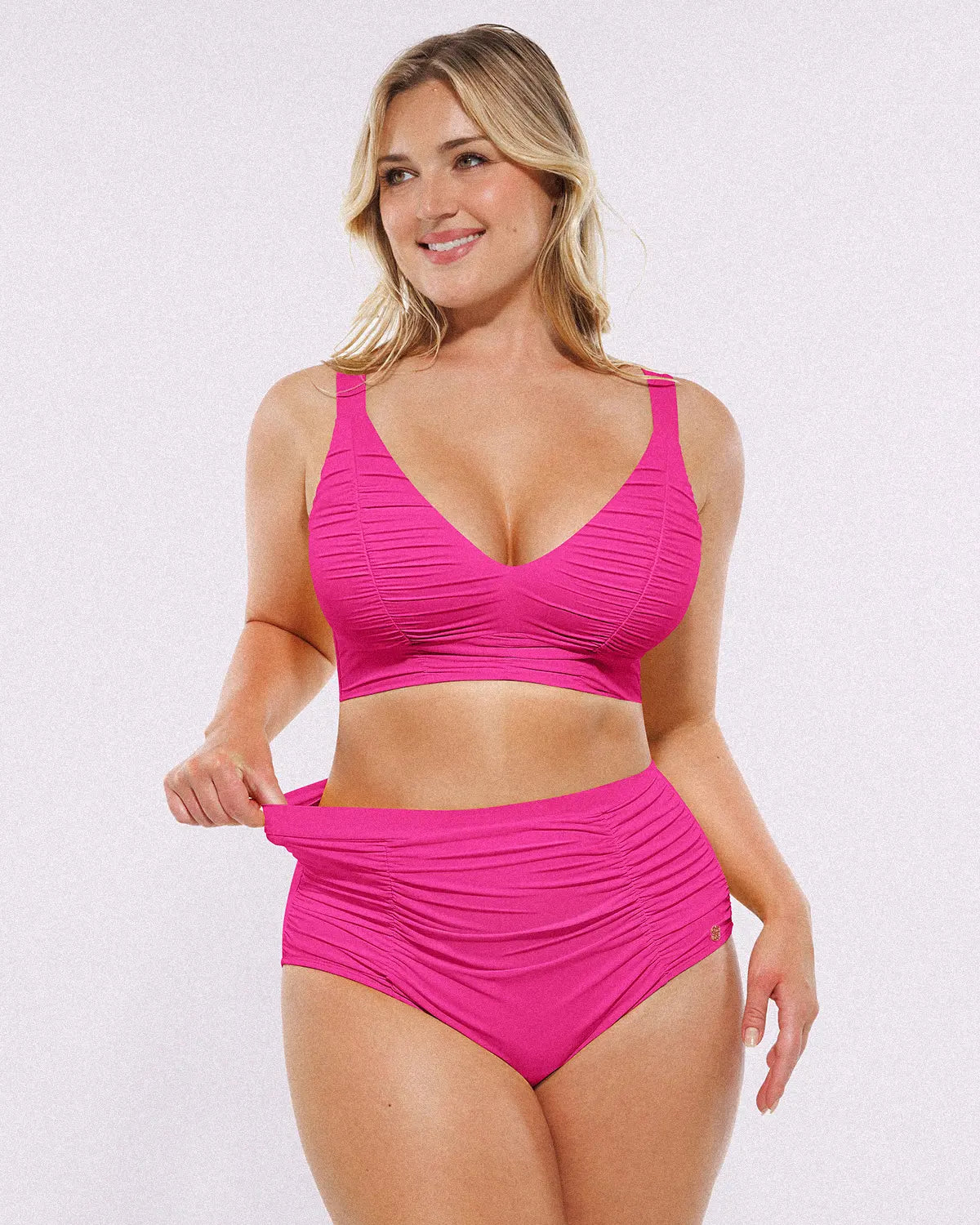 Model wearing Smart Sculpt Ruched V-Neck Bikini Top and High-Waisted Bottom Set, showing tummy-smoothing fit