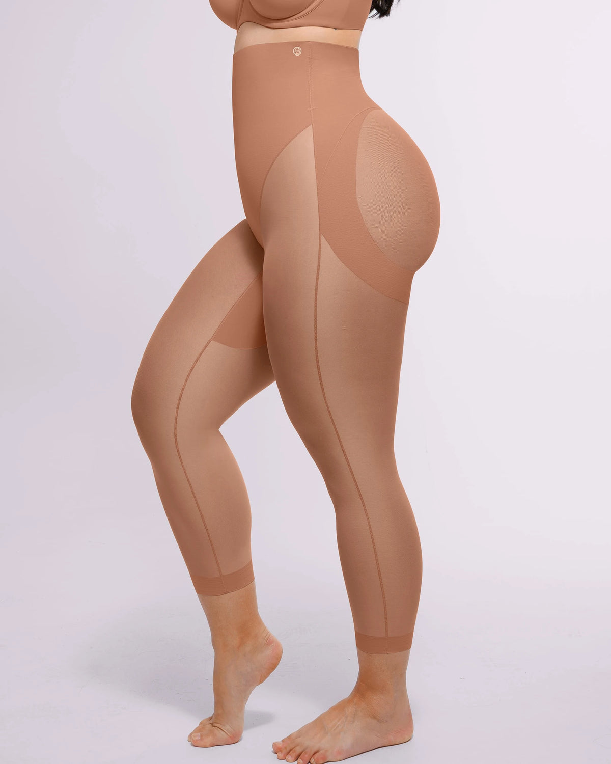 Creating a streamlined waistline with targeted compression through the midsection