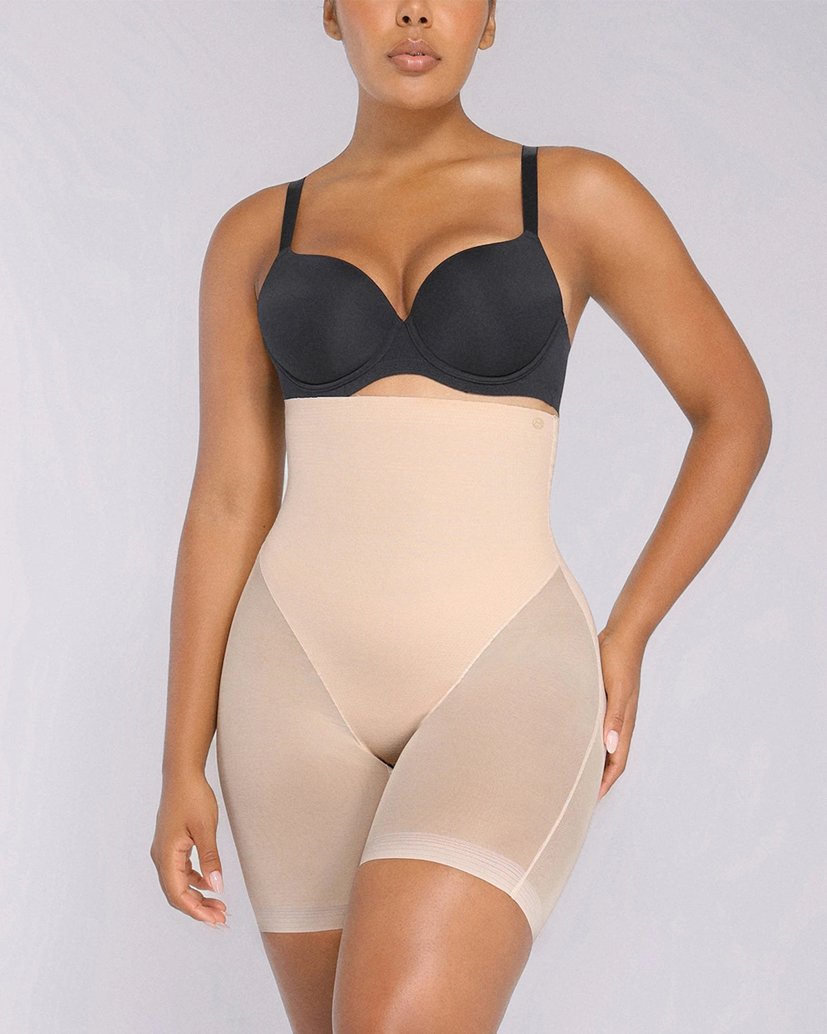Model wearing black high-waisted mesh shaping shorts with butt-lifting support