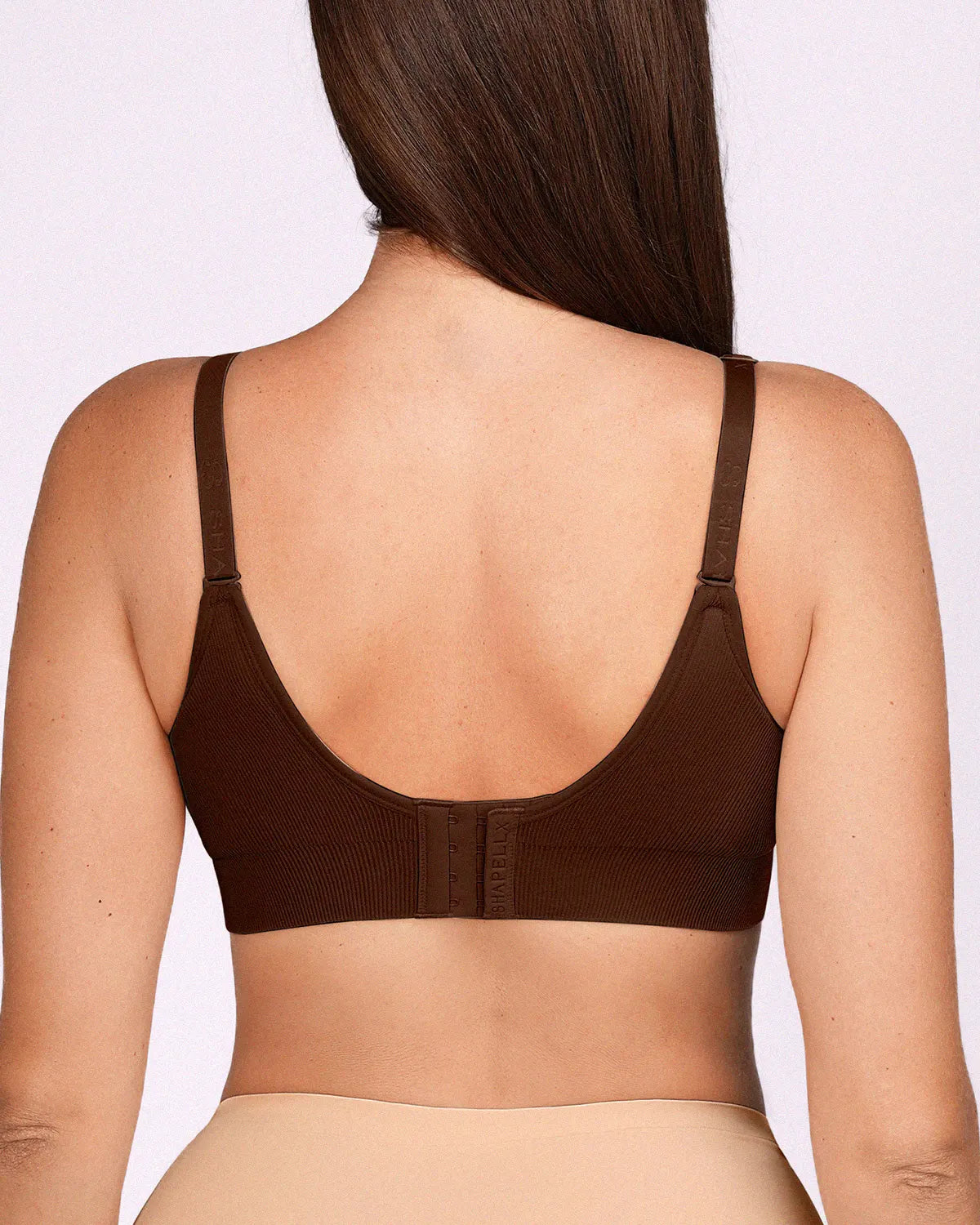 Back view of a brown wireless push-up bra featuring back smoothing wings to eliminate bulges.