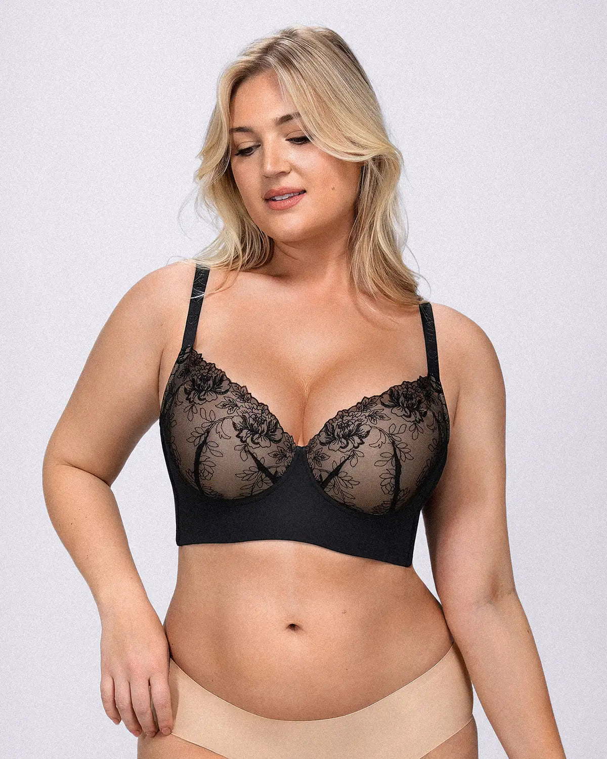 Model wearing lace underwire bra with supportive lift and smooth silhouette