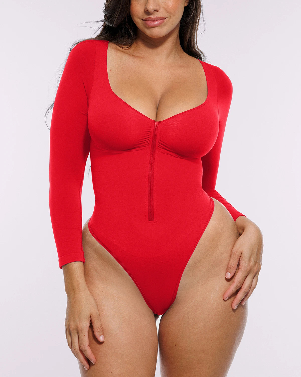 Bare Essentials™ Skin Flow™ Long Sleeve Zipper Front Thong Bodysuit