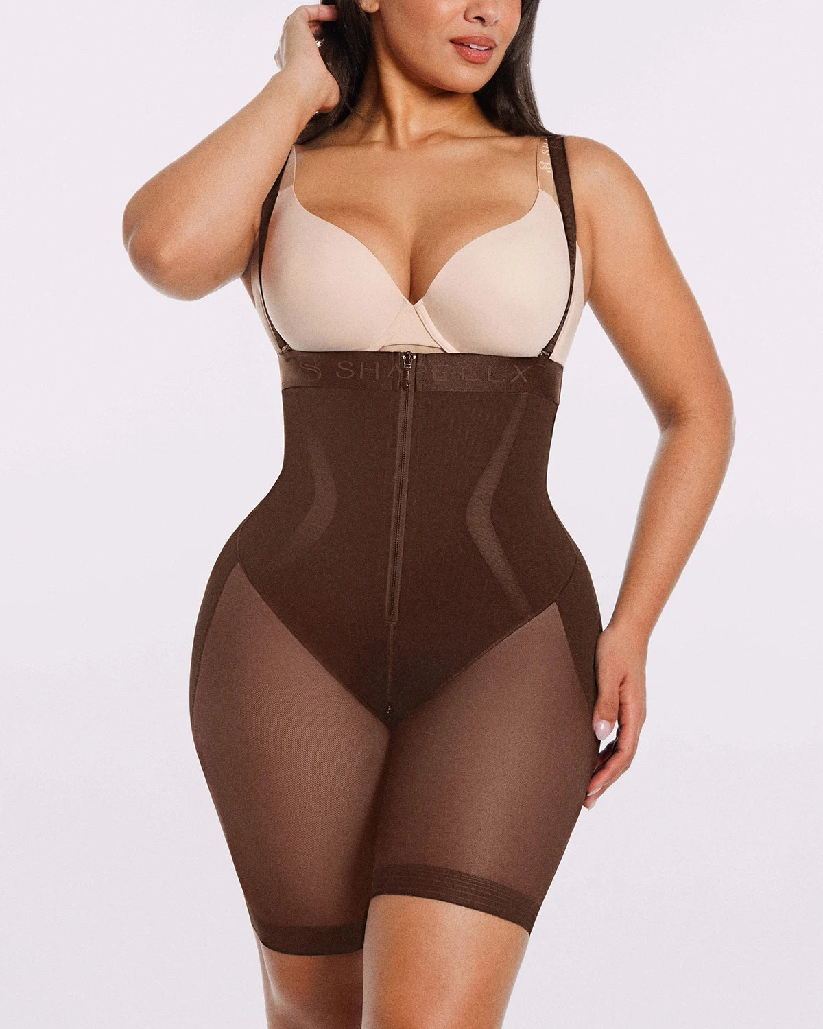 Model wearing brown  airy smoothing shorts with a sleek and comfortable fit