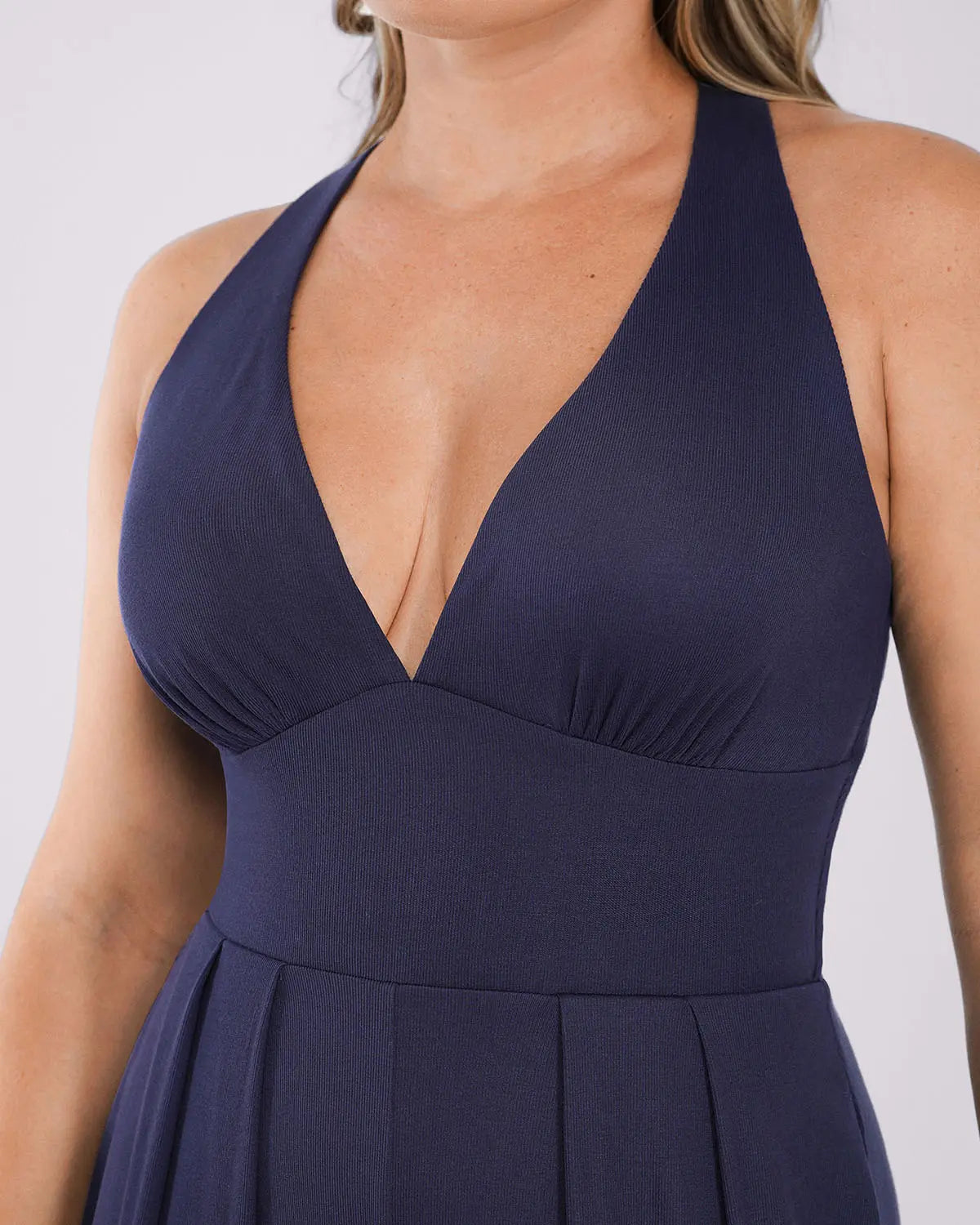 Deep V shaping jumpsuit with built-in support and waist sculpting design